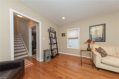The Living Room. Next to the staircase can be seen the doorway to the office