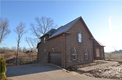 2 car side entry garage with large turn around.