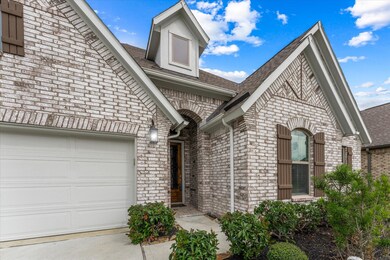 An impressive brick entry has an oversized wood and glass door with iron inlay will welcome all who enter this beautiful home.
