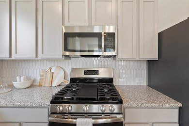Kitchen with appliances with stainless steel fini