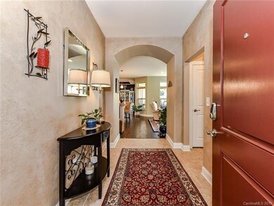 Easy care ceramic tile foyer and decorative arched