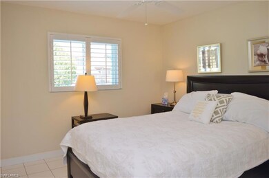 Bedroom featuring baseboards and tile patterned fl