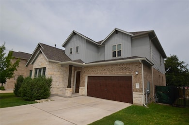 View of front of home with an attached garage, dr