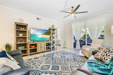 Living room with ceiling fan, tile patterned floor