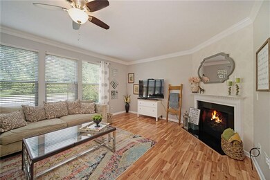 Large family room with wall to wall windows and fireplace