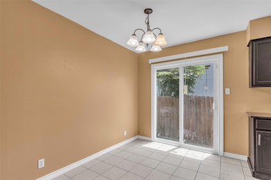 Unfurnished dining area with a chandelier, light 
