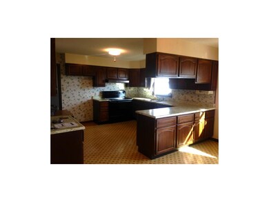 Spacious kitchen with door to laundry room