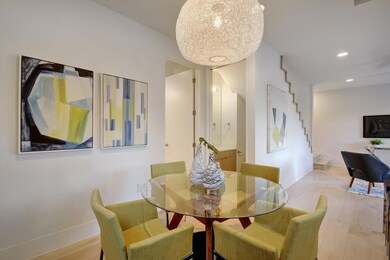 Dining area featuring light wood-style floors, st