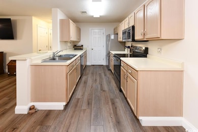 Kitchen with sink, appliances with stainless steel