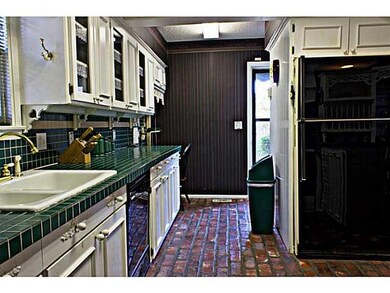 Kitchen. Brick paver floors, lots custom cabinets 