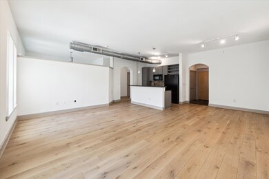 The light oak wood flooring, stylish cabinets, mod