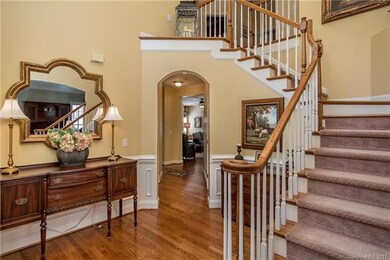 Front Foyer leads to the Back Hallway.