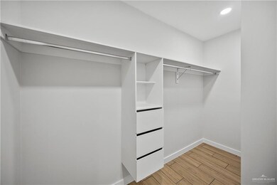Walk in closet featuring light wood-type flooring