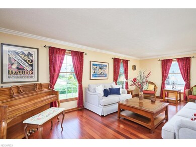 Spacious, airy living room with large windows.
