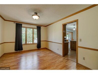 Formal dining room floods with natural light.