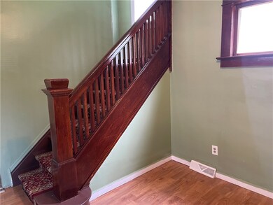 Hardwood staircase to the upper levels