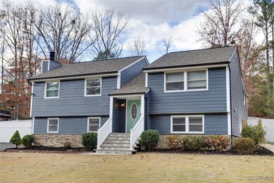 Bi-level home with a front lawn