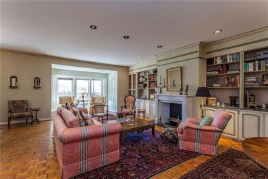 Living room toward fireplace and access to covered