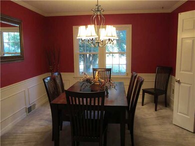 Appealing dining room overlooks the back yard, has