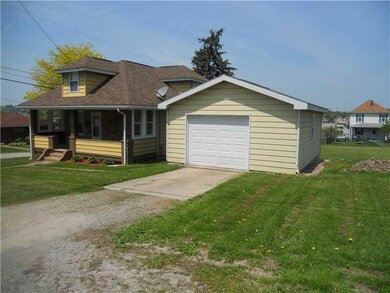 Exterior Front. The attached one car garage offers
