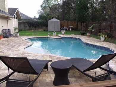 Free form pool w/3 water fall features.  Pavers surround.  Footings laid for screening in.
