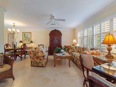 Fully tiled with white plantation shutters, the fo