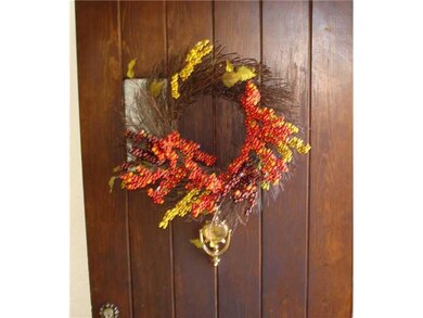 Exterior Front. Original solid wood door