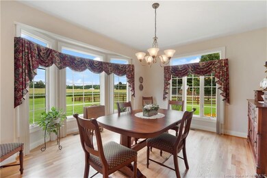 Formal dining room has plenty of space for enterta
