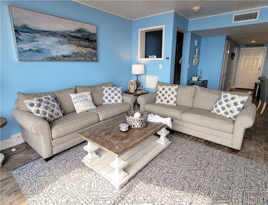 The window walls offer plenty of natural light.