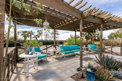 View of patio featuring an outdoor area and a perg