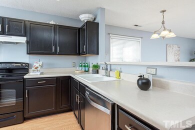 Kitchen features stainless steel appliances and lo