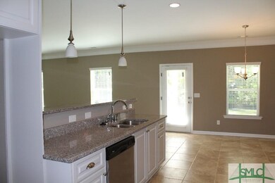 Breakfast bar open to family room, granite counter