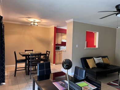 Tiled dining space featuring ceiling fan and ornam