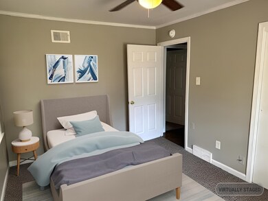 Bedroom with baseboards, crown molding, a ceiling 