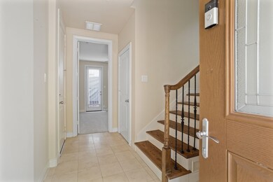 Entry area has tile floors and leads to 1st floor