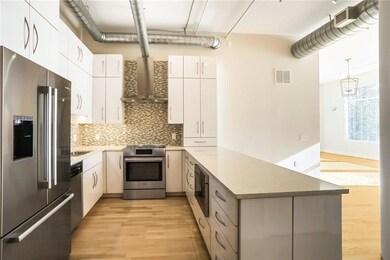 Kitchen with visible vents, appliances with stainl