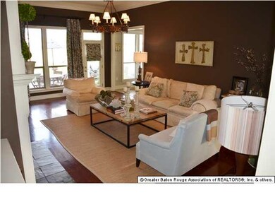 Living Room- fireplace with slate tile surround, wood floors, built-ins galore, surround sound and breathtaking view of the lake.