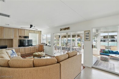 Wall of built in cabinets in a beachy wood color