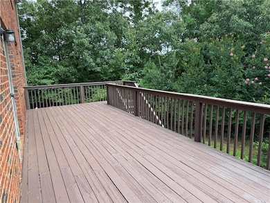 Deck featuring view of scattered trees