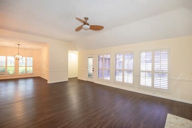 A wall of windows allows natural light to pour in,