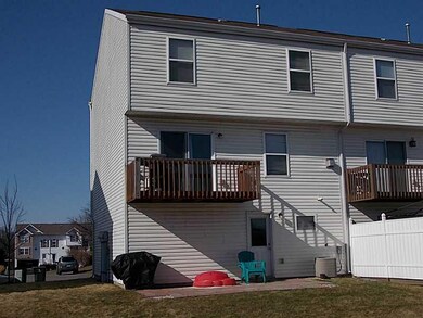 Exterior Front. small upper deck with sliding glas