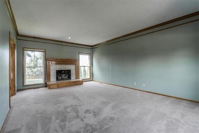 Large Great room featuring fireplace and entrance 