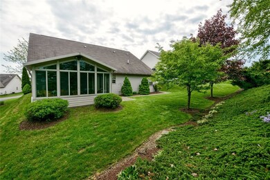 The glassed Three Season Room sets this home apart! It opens to a patio and a beautiful private yard.  But let's go inside....