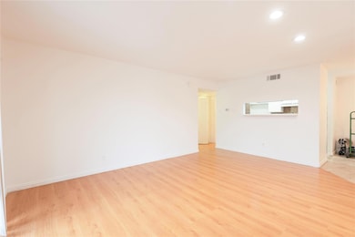 BR with light wood-type flooring