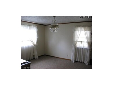 The dining room is freshly painted and has new car