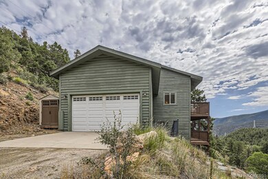 Gorgeous home 5 minutes from Idaho Springs with nice garage and 8 acres!