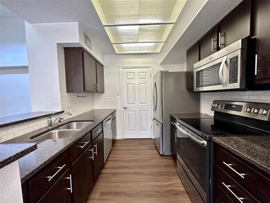 Kitchen featuring stainless steel appliances, a s