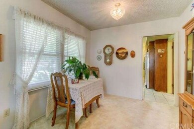 Dining Area with elegant light fixture.