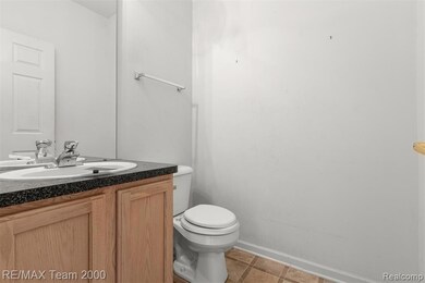 Bathroom with vanity and light tile patterned floors