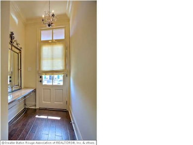 Entry way with nook and beautiful chandelier